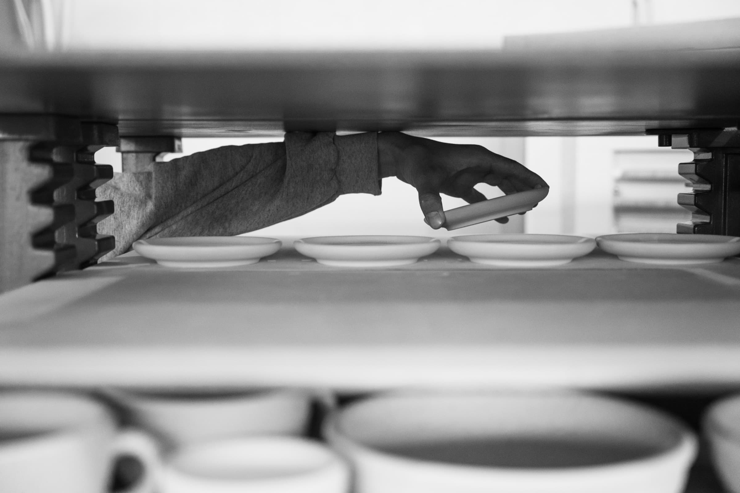 Saucers being placed in the kiln